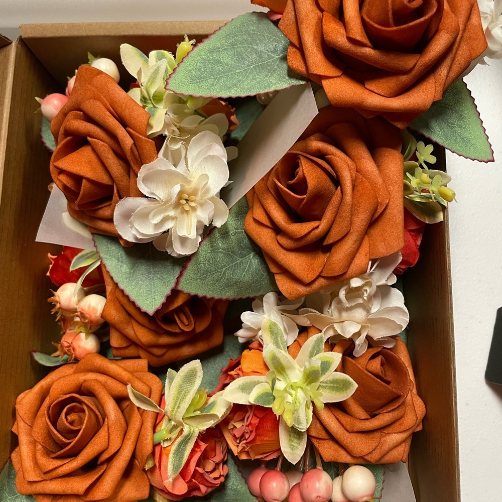 Rust Orange and White Floral corsage and boutonnière.
